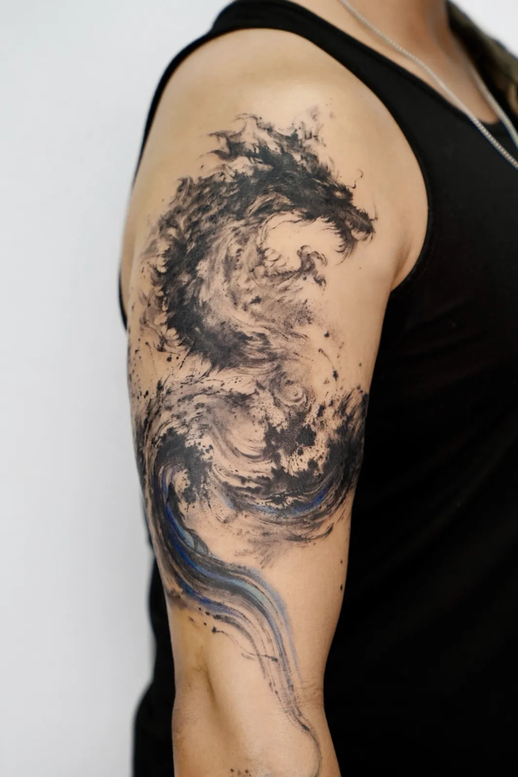 Brushstroke tattoo by a Baron Art artist